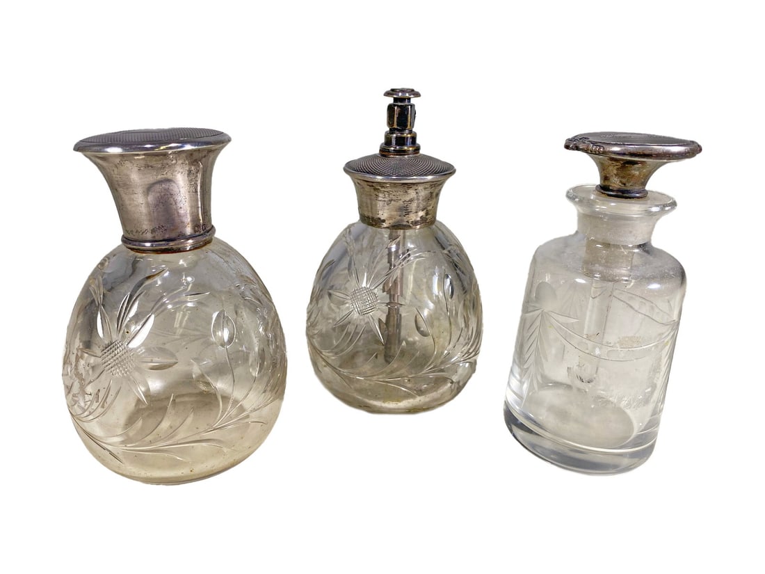 3 English Sterling Silver & Crystal Perfurm Bottles: 3 English Sterling Silver & Crystal Perfurm Bottles. 3 7/8 x 2 1/2 in, 4 1/4 x 2 1/2 in and 4 x 1 7/8 in.Local Pick up call one day before to make an appointment. TO SHIP THIS ITEM IN USA OR INTERNATI