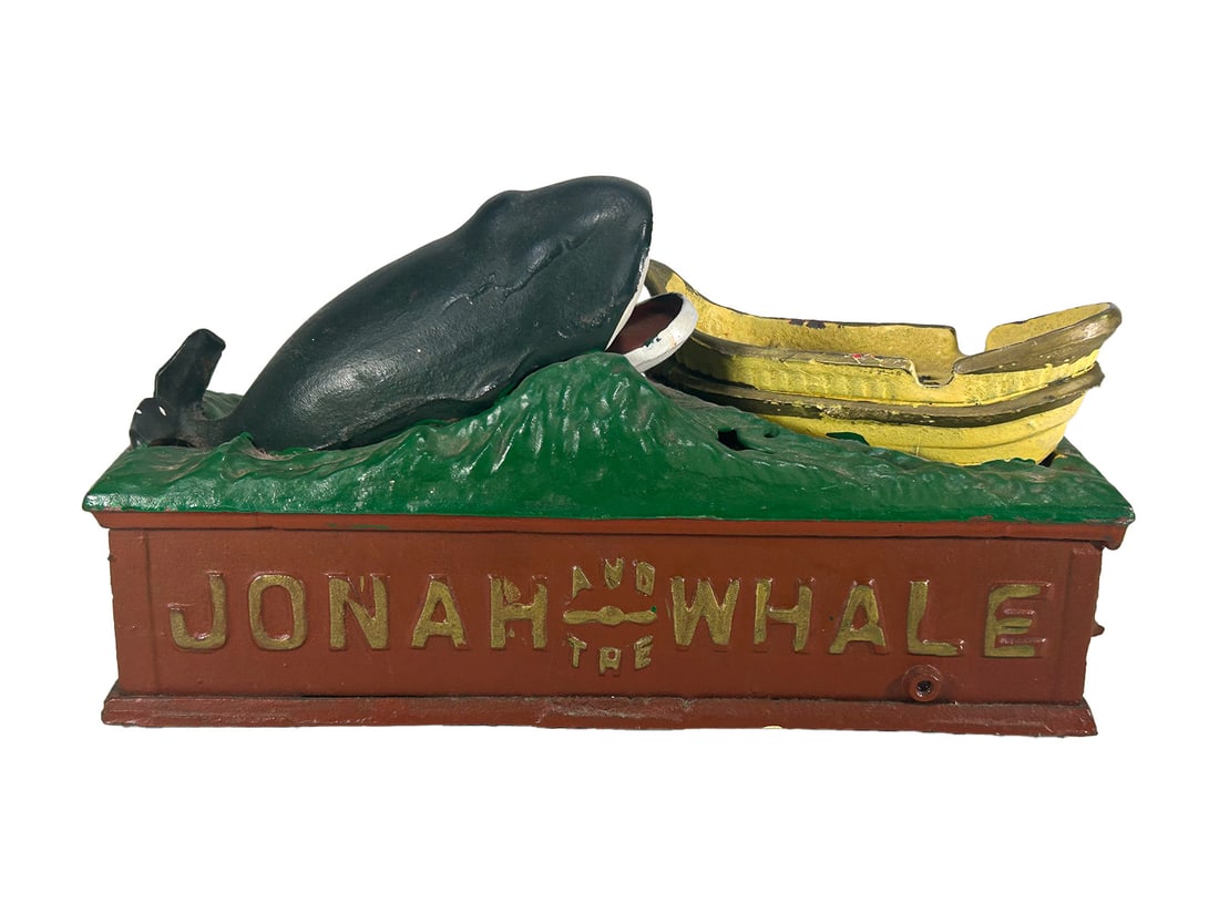 Jpnah & The Whale Mechanical Iron Coin Bank: Jpnah & The Whale Mechanical Iron Coin Bank. 5 1/4 x 9 3/4 x 3 1/2 in.Local Pick up call one day before to make an appointment. TO SHIP THIS ITEM IN USA OR INTERNATIONAL, PLEASE CONTACT THE SHIPPERS :