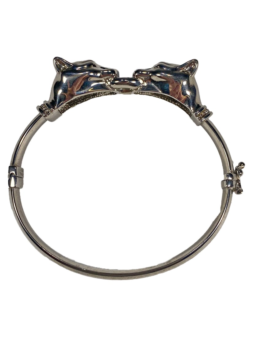 Sterling 925 Panthers Bracelet: Sterling 925 Panthers Bracelet. Weight: 23 grams. 1 7/8 x 2 1/8 in internal.Local Pick up call one day before to make an appointment. TO SHIP THIS ITEM IN USA OR INTERNATIONAL, PLEASE CONTACT THE SHIP