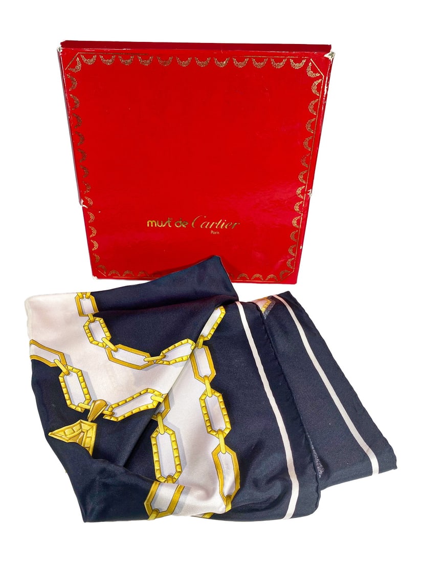 Must de Cartier, Paris Scarf: Must de Cartier, Paris Scarf. Box: 5/8 x 9 3/8 x 9 3/8 in.Small damages on the outside box. Local Pick up call one day before to make an appointment. TO SHIP THIS ITEM IN USA OR INTERNATIONAL, PLEASE