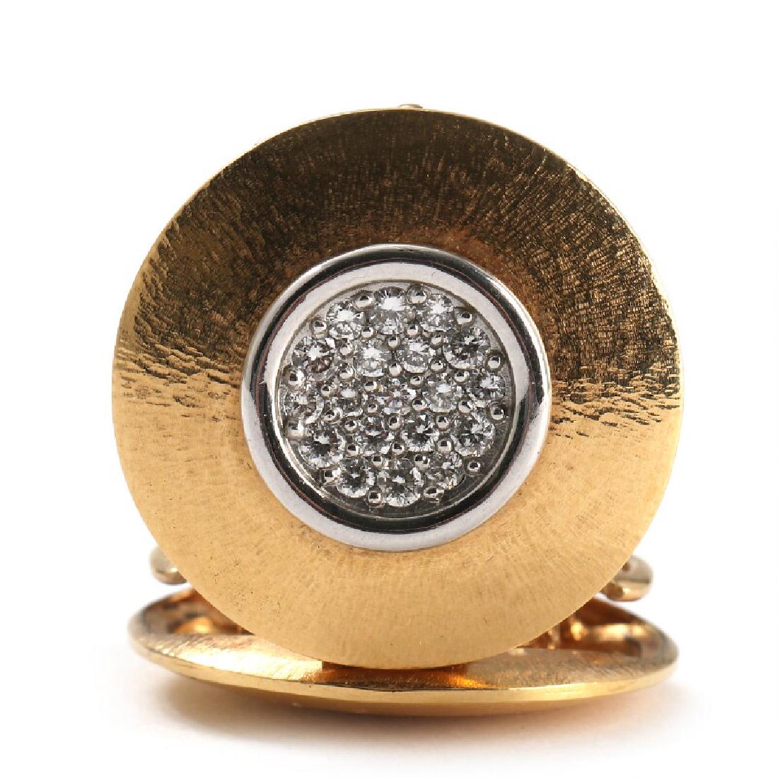 Ole Lynggaard: A diamond clasp set with numerous: A diamond clasp set with numerous brilliant-cut diamonds totalling 0.44 ct., mounted in 18k gold and white gold. Colour: Wesselton. Clarity: VS. L. 2.5 cm. Weight app. 12.5 g. 2003. Certificate of pur