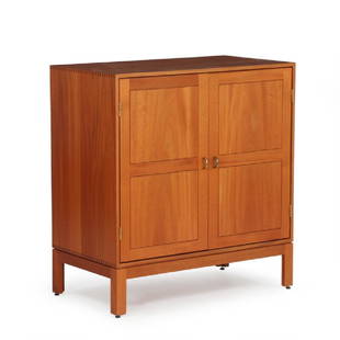 Christian Hvidt: Cabinet of mahogany with brass: Cabinet of mahogany with brass handles, inside with shelves and storage. Manufactured and marked by Søborg Møbler. H. 96 cm. W. 90 cm. D. 49 cm.