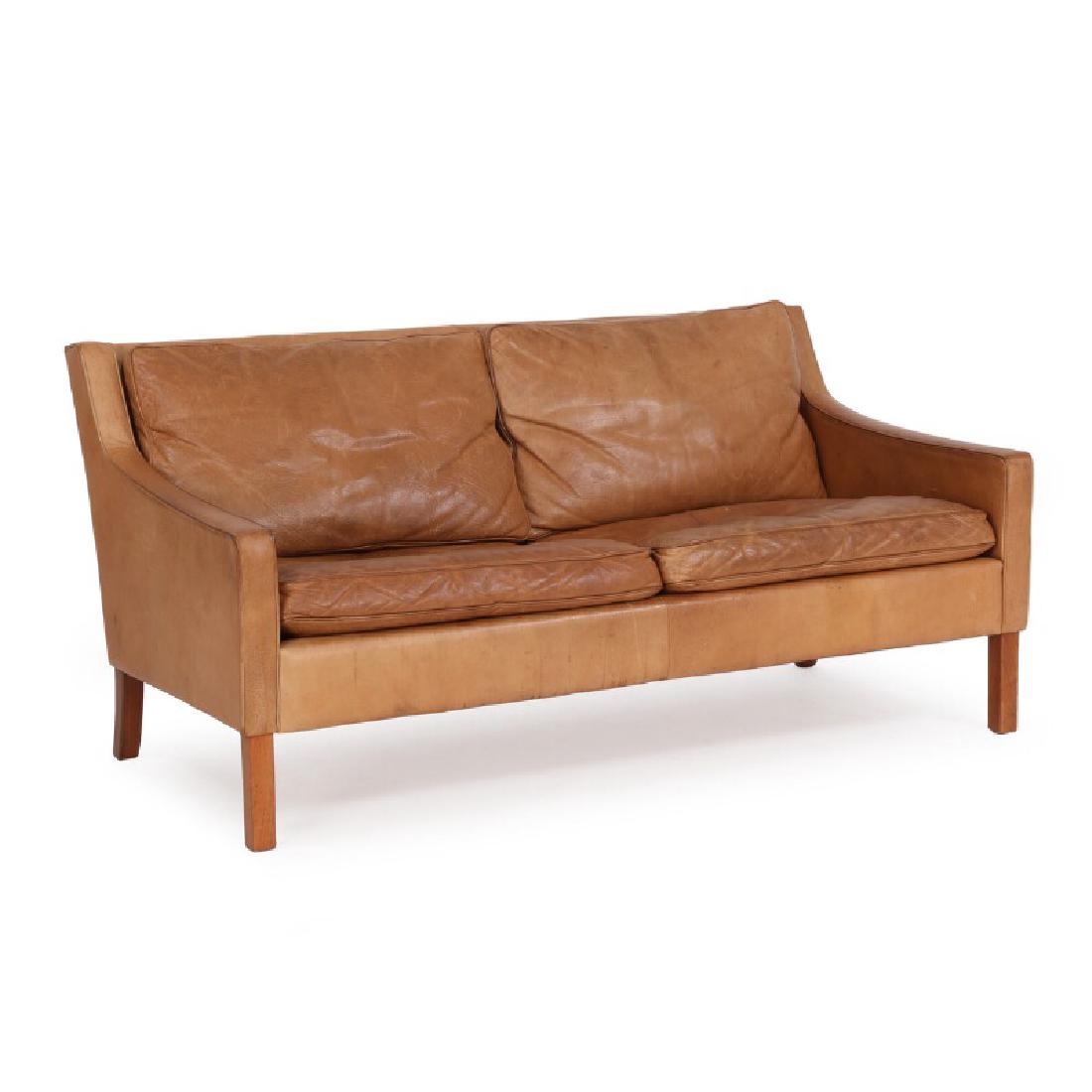 Ingemar Thillmark: Two seater sofa with legs of nut: Freestanding two seater sofa with legs of nut wood. Seat cushions, sides and back upholstered with brown coloured leather. Manufactured by OPE. Retailed by Illums Bolighus with plaquette. H. 71 cm. L.