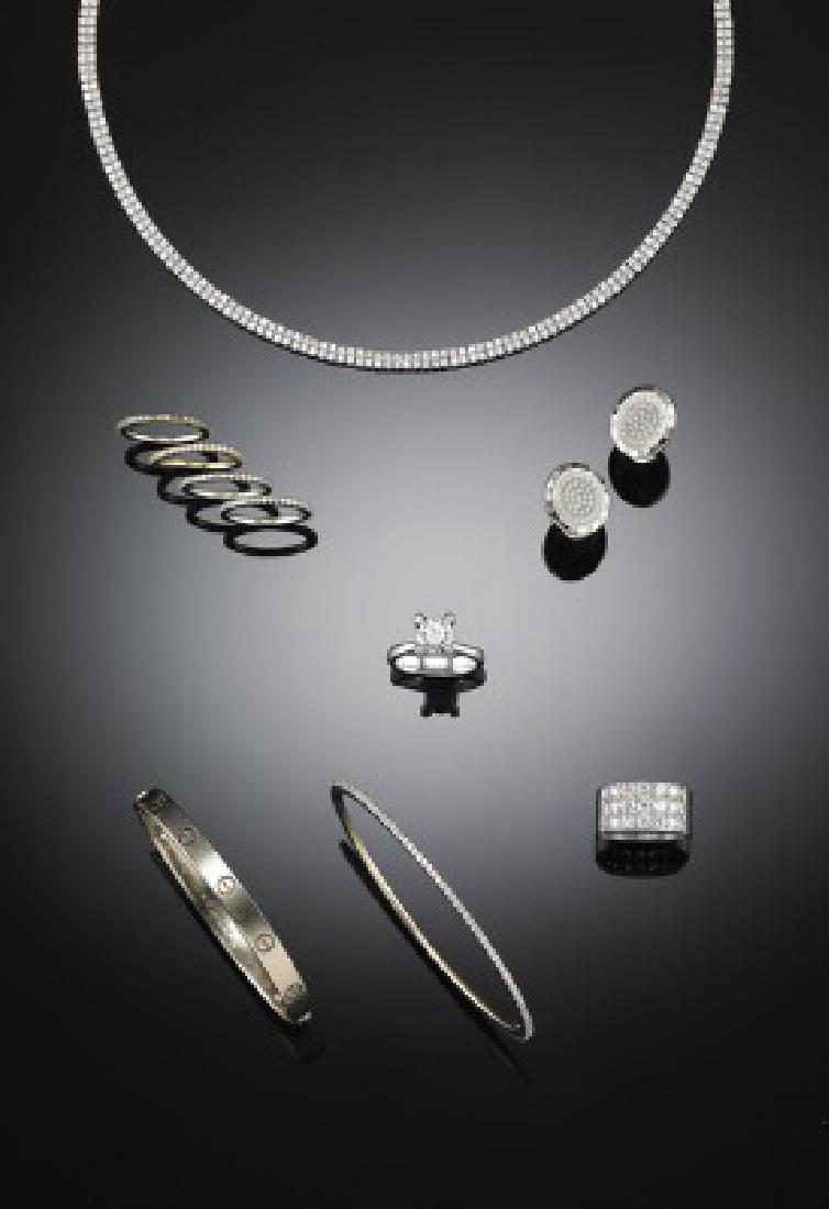 Ole Lynggaard: A diamond ring set with a brilliant-cut: A diamond solitaire ring set with a brilliant-cut diamond weighing app. 1.99 ct., mounted in 14k white gold. Colour: Light Yellow (O). Clarity: VSI. Size 53.5. Accompanied by certificate from H. Walth