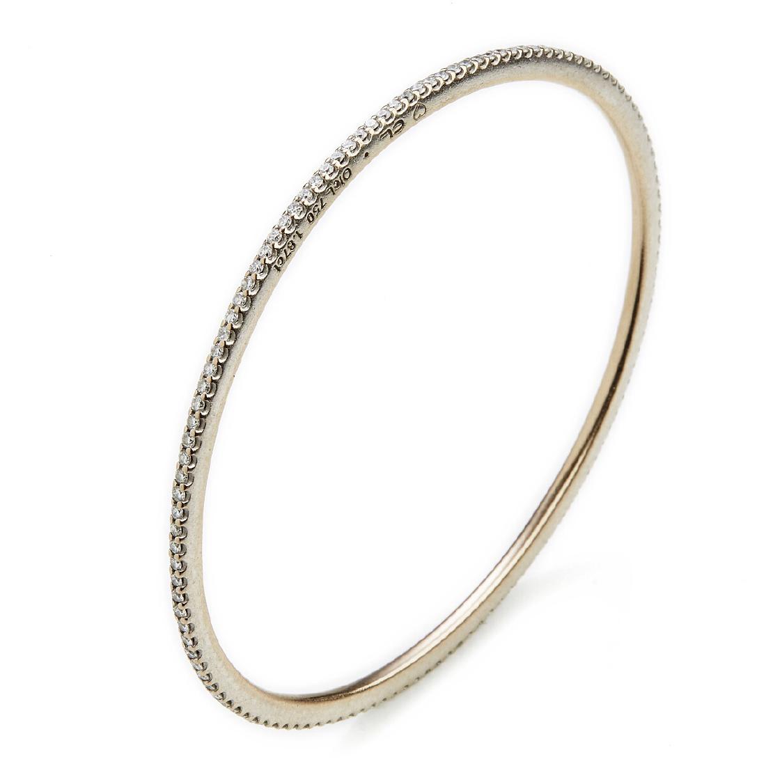 Ole Lynggaard: A "Love Band" diamond bangle set with: A "Love Band" diamond bangle set with numerous briliant-cut diamonds weighing a total of app. 1.87 ct., mounted in 18k white gold. Colour: Top Wesselton (G). Clarity: VS. Diam. app. 7 cm. Design Charl