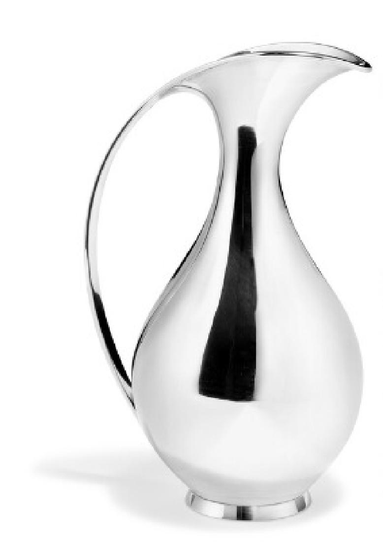 Kay Fisker: Sterling silver water pitcher. Made and: Sterling silver water pitcher. Made and marked by A. Michelsen with dating mark C10=1977. Designed 1927. Weight 660 gr. H. 24 cm. Artist: Kay Fisker (b. Frederiksberg 1893, d. København 1965)