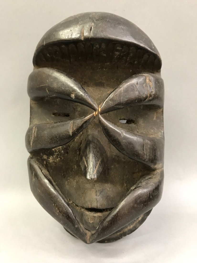 Bete Mask: African Art Bete Mask is from Ivory Coast. The dimension is 9 inches high x 5.5 inches wide. The shipping cost for domestic is $45.00 flat rate shipping within the Continental US, the International fo