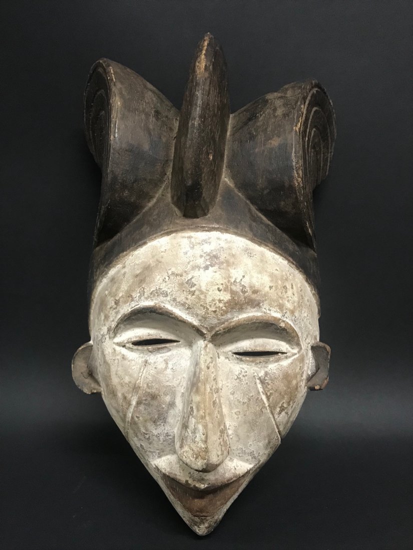 Ibo Mask: African Art Ibo Mask from Nigeria. The dimension is 13.5 inches high x 8 inches wide. The packing and shipping cost with insurance for domestic is $45.00 flat rate shipping within the Continental US, 