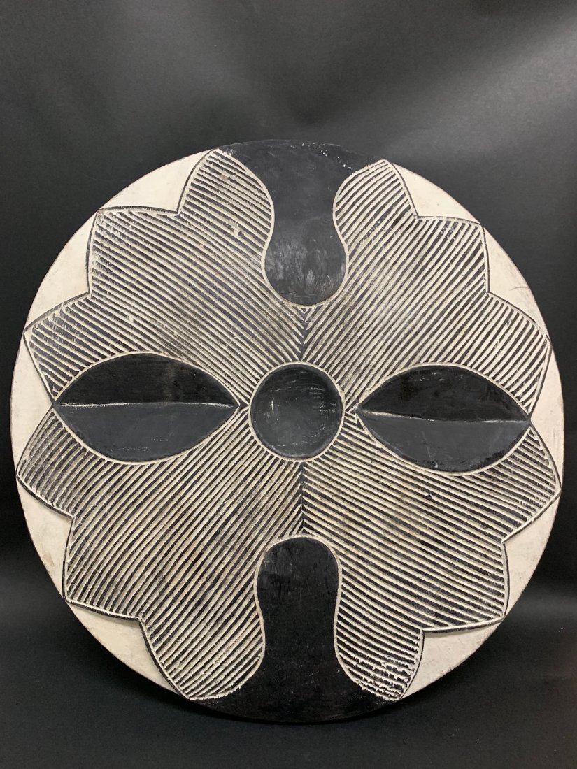 Zulu Round Shield: African Art Zulu Shield is from South Africa. The dimension is 21.25 inches high x 20.5 inches wide. The packing and shipping cost with insurance for domestic is $50.00 flat rate shipping within the C