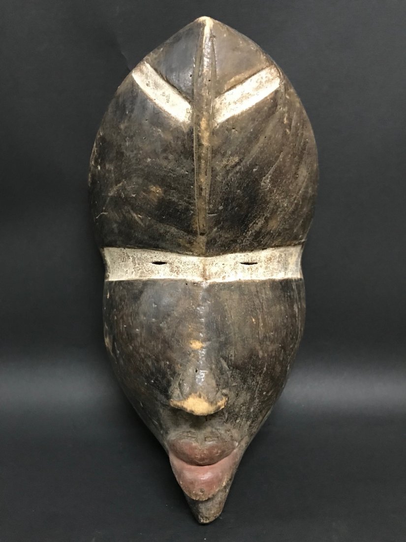 Dan Mask: African Art Dan Mask, Ivory Coast, Dimension is 13 inches high x 7.5 inches wide. The shipping cost for domestic is $35.00 flat rate shipping within the Continental US, international foreign shipping 