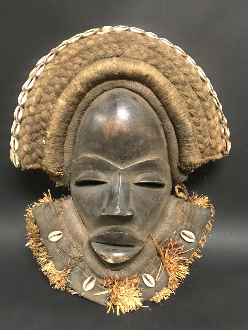 Dan Mask: African Art Dan Mask, Ivory Coast. The dimension is 14 inches high x 12.25 inches wide. The packing and shipping cost with insurance for domestic is $35.00 flat rate shipping within the Continental US