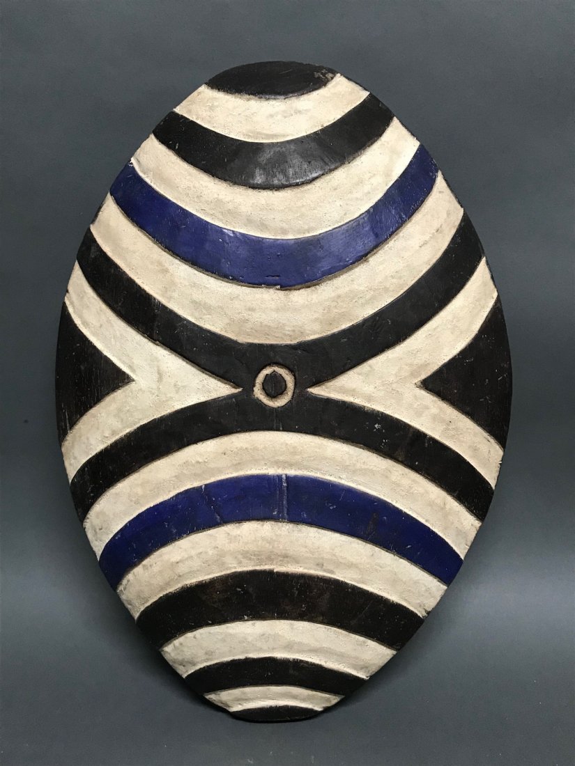 Zulu Shield: African Art Zulu Shield from South Africa. The dimension 16 inches high x 13 inches wide. The packing and shipping cost with insurance for domestic is $45.00 flat rate shipping within the Continental 
