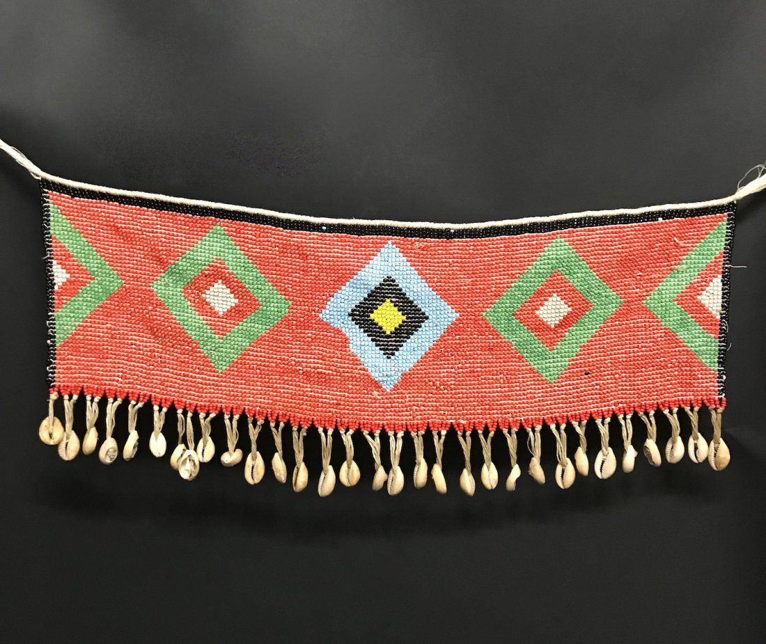 Kirdi Apron Beadwork: African Tribal Art Kirdi Apron Beadwork, Cameroon, Dimension is 8 inches high x 20 inches wide. The shipping cost for domestic is $20.00 flat rate shipping within the Continental US, international for