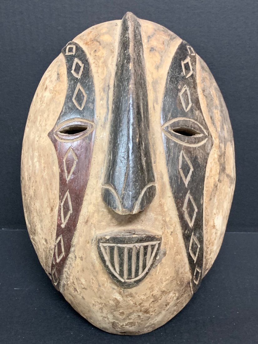 Igbo Mask: African Tribal Art Igbo Mask from Nigeria. The dimension 13.5 inches high x 9.5 inches wide. The packing and shipping cost with insurance for domestic is $40.00 flat rate shipping within the Continent