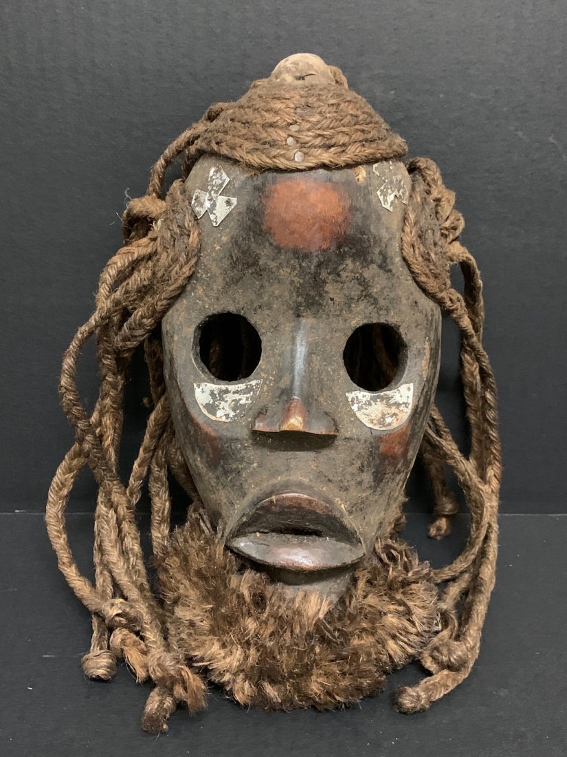 Dan Mask: African Tribal Art Dan Mask from Ivory Coast. The dimension 10 inches high x 5.5 inches wide. The packing and shipping cost with insurance for domestic is $35.00 flat rate shipping within the Continen