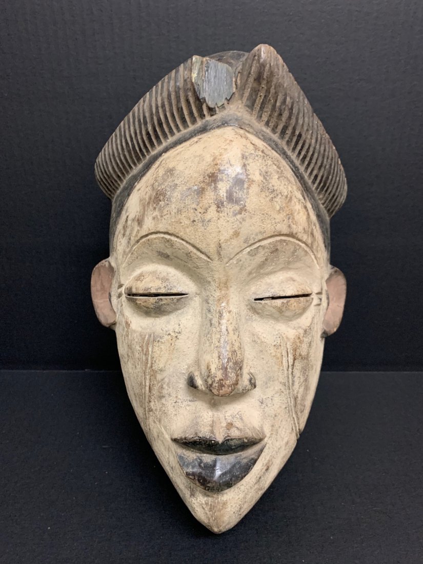 Ibo Mask: African Tribal Art Ibo Mask from Nigeria. The dimension 14 inches high x 8 inches wide. The packing and shipping cost with insurance for domestic is $40.00 flat rate shipping within the Continental US