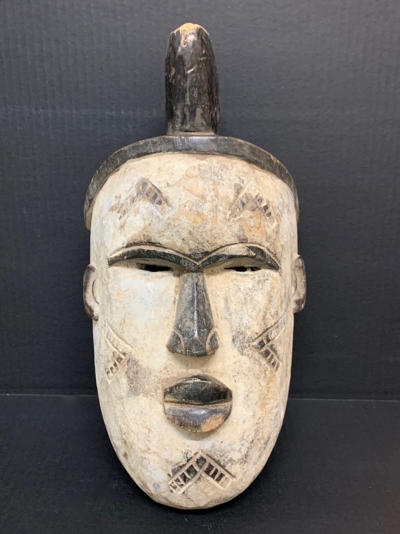 Ibo Mask: African Art Ibo Mask is from Nigeria. The dimension is 16 inches high x 6 inches depth x 8.5 inches wide. The shipping cost for domestic is $40.00 flat rate shipping within the Continental US, the Int