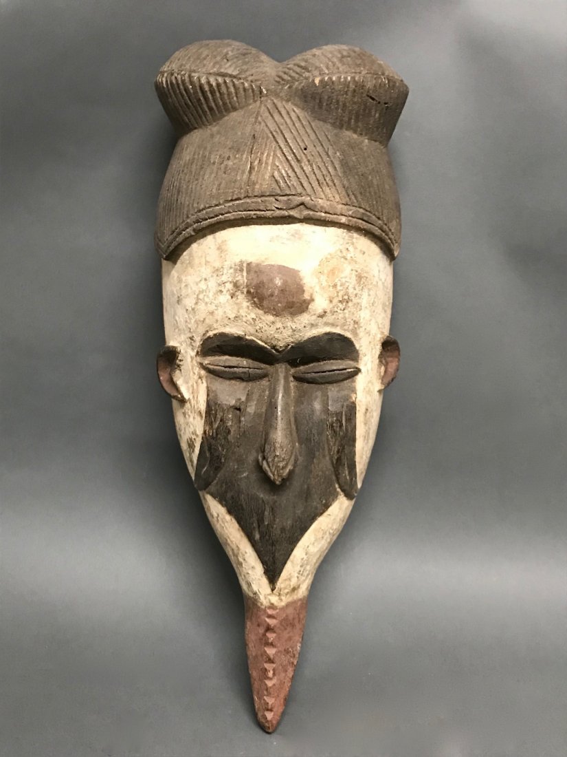 Ibo Mask: African Art Ibo Mask is from Nigeria. The dimension is 18.5 inches high x 7.5 inches wide. The shipping cost for domestic is $45.00 flat rate shipping within the Continental US, the International fore