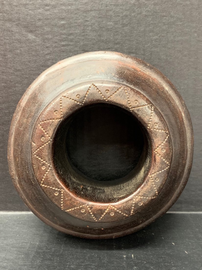 Nigerian Wood Currency Bracelet: African Art Nigerian Wood Currency Bracelet is from Nigeria. The dimension is 7 inches high x 3.25 inches wide. The shipping cost for domestic is $30.00 flat rate shipping within the Continental US, t