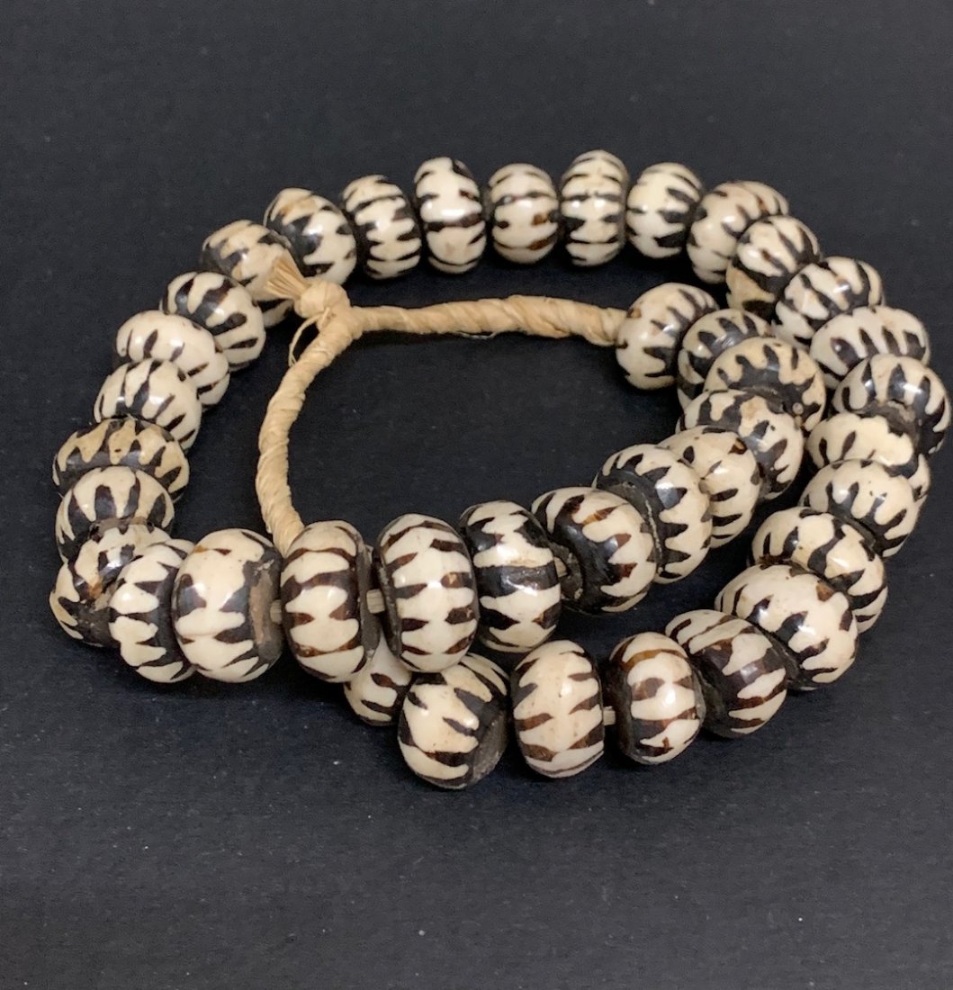 Batik Bone Beads Necklace: African Art Batik Bone Beads Necklace. The dimension is 26 inches rounds. The shipping cost for domestic is $20.00 flat rate shipping within the Continental US, the International foreign shipping rate
