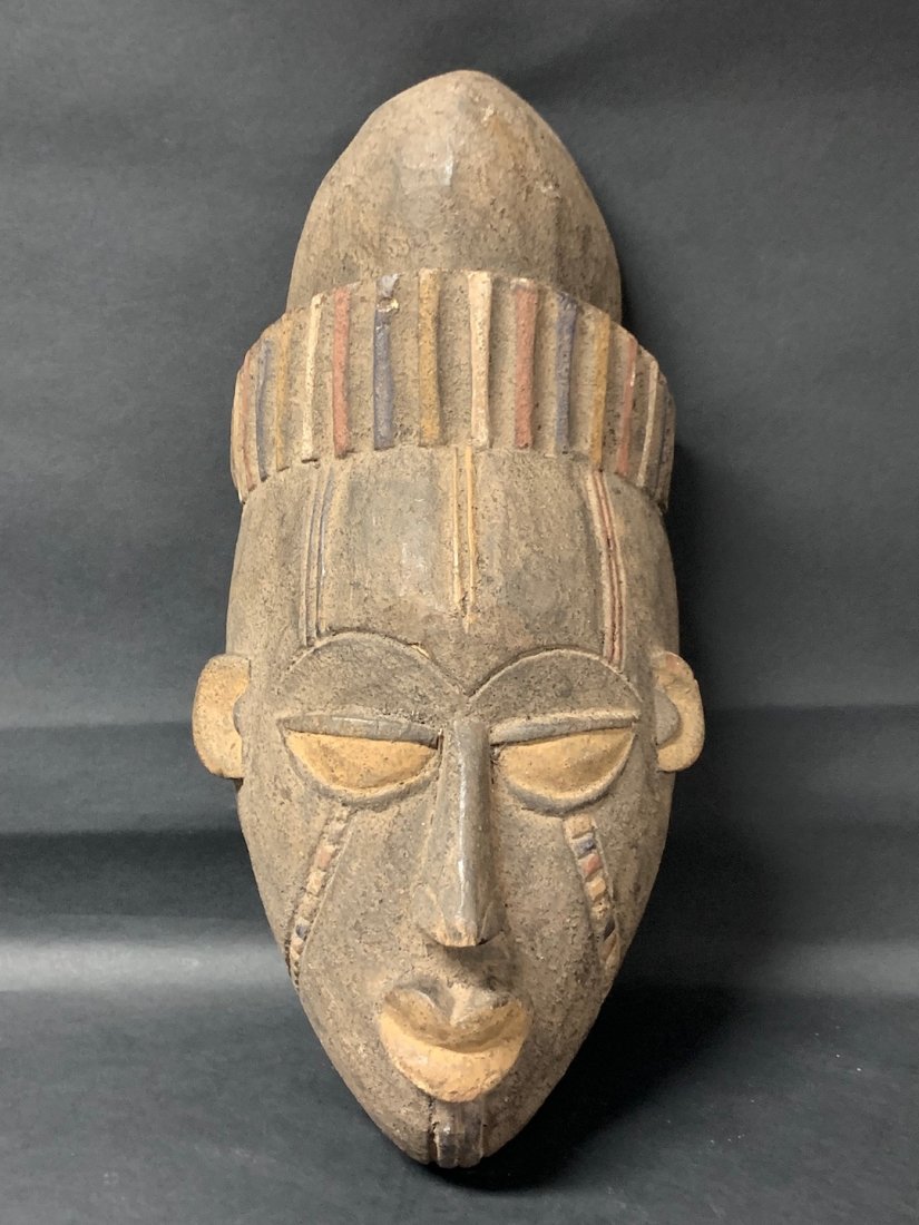 Yoruba Mask: African Art Yoruba Mask from Nigeria. The dimension is 17 inches high x 8 inches wide. The shipping cost for domestic is $45.00 flat rate shipping within the Continental US including handling, packing