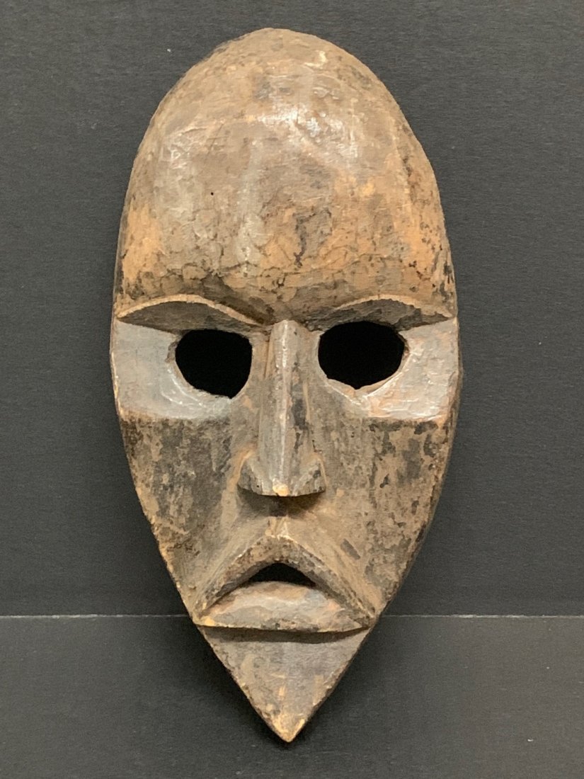Dan Mask: African Art Dan Mask from Liberia. The dimension is 12 inches high x 7 inches wide. The shipping cost for domestic is $30.00 flat rate shipping within the Continental US including handling, packing an