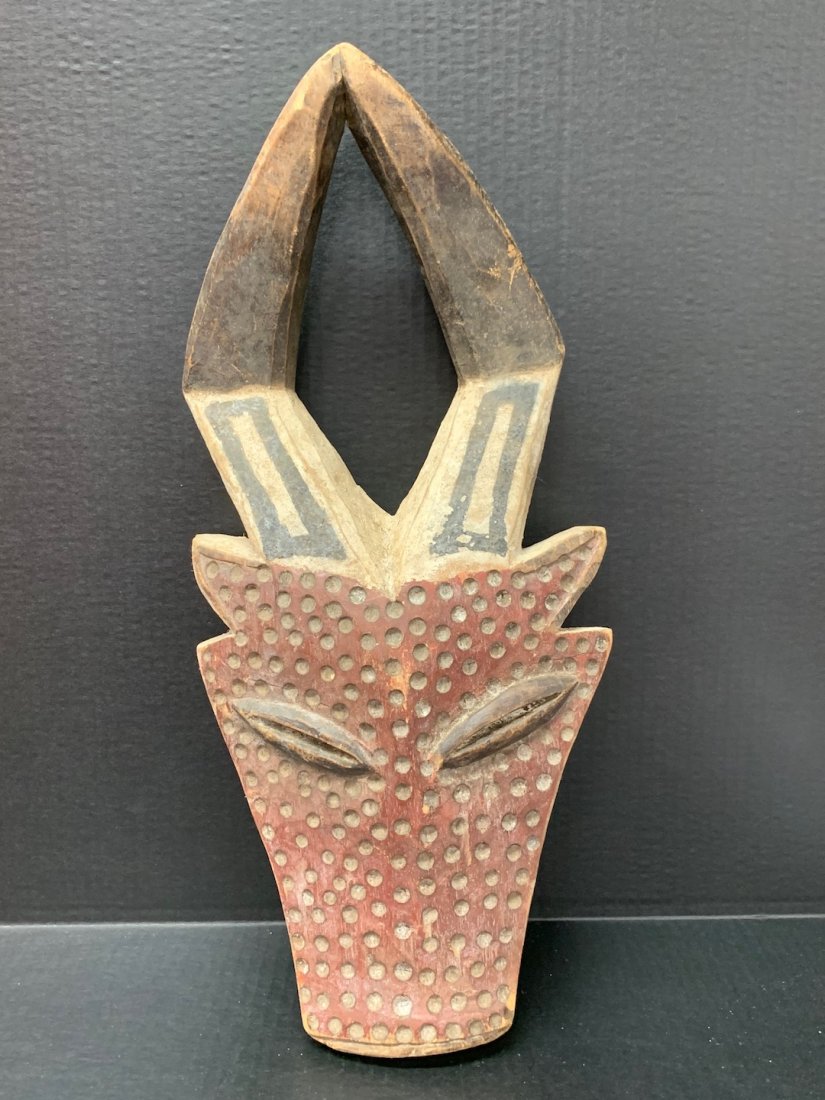 Ram Mask: African Art Ram Mask from Ivory Cameroon. The dimension is 21 inches high x 10 inches wide. The shipping cost for domestic is $45.00 flat rate shipping within the Continental US including handling, pa