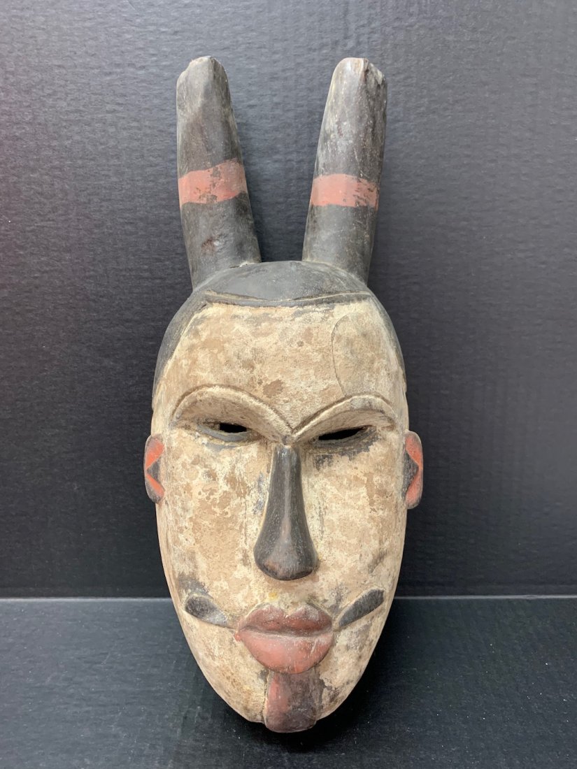 Ogoni Mask: African Art Ogoni Mask from Nigeria. The dimension is 15.5 inches high x 7 inches wide. The shipping cost for domestic is $45.00 flat rate shipping within the Continental US including handling, packin