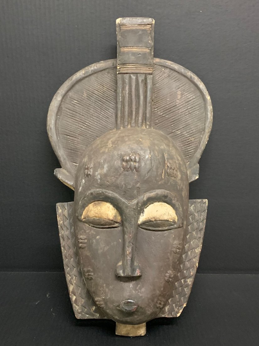 Large Baule Mask: African Art Baule Mask from Ivory Coast. The dimension is 21 inches high x 12 inches wide. The shipping cost for domestic is $55.00 flat rate shipping within the Continental US including handling, pac