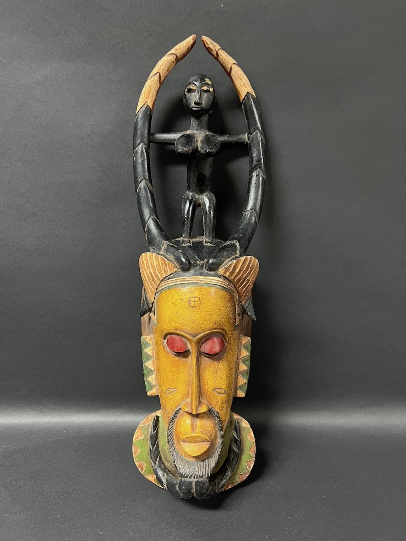 Guru Mask: African Art Guru Mask from Ivory Coast. The dimension is 18.5 inches high x 6 inches wide. The shipping cost for domestic is $45.00 flat rate shipping within the Continental US including handling, pac