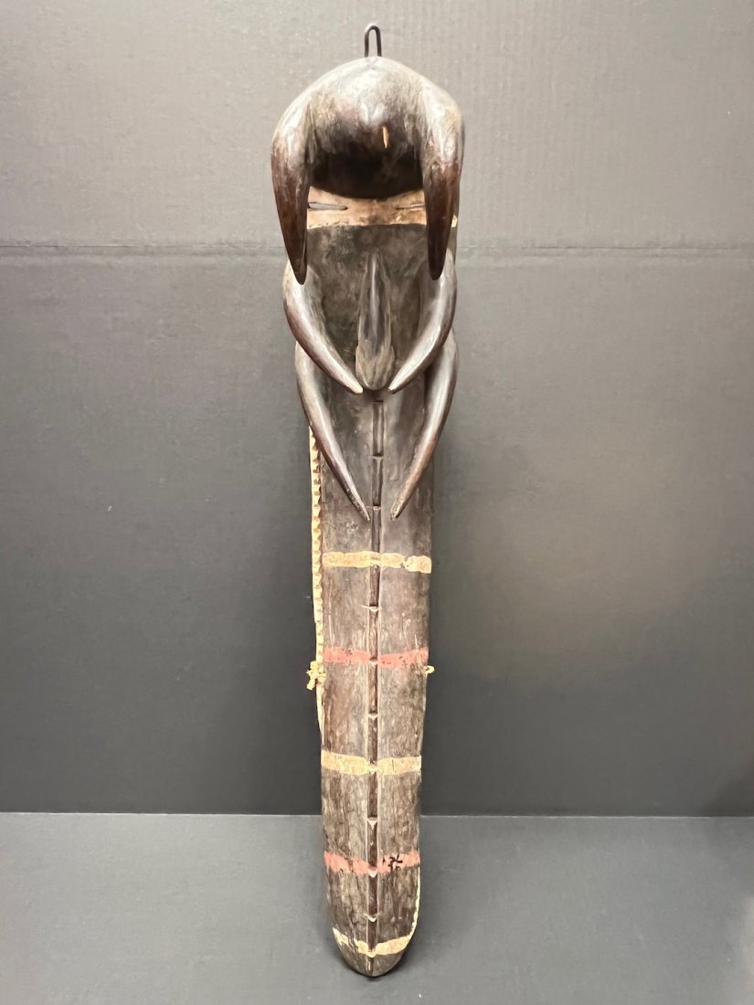 Bete Mask: African Art Bete Mask from Ivory Coast. The dimension is 28 inches high x 5.5 inches wide. The shipping cost for domestic is $55.00 flat rate shipping within the Continental US including handling, pac