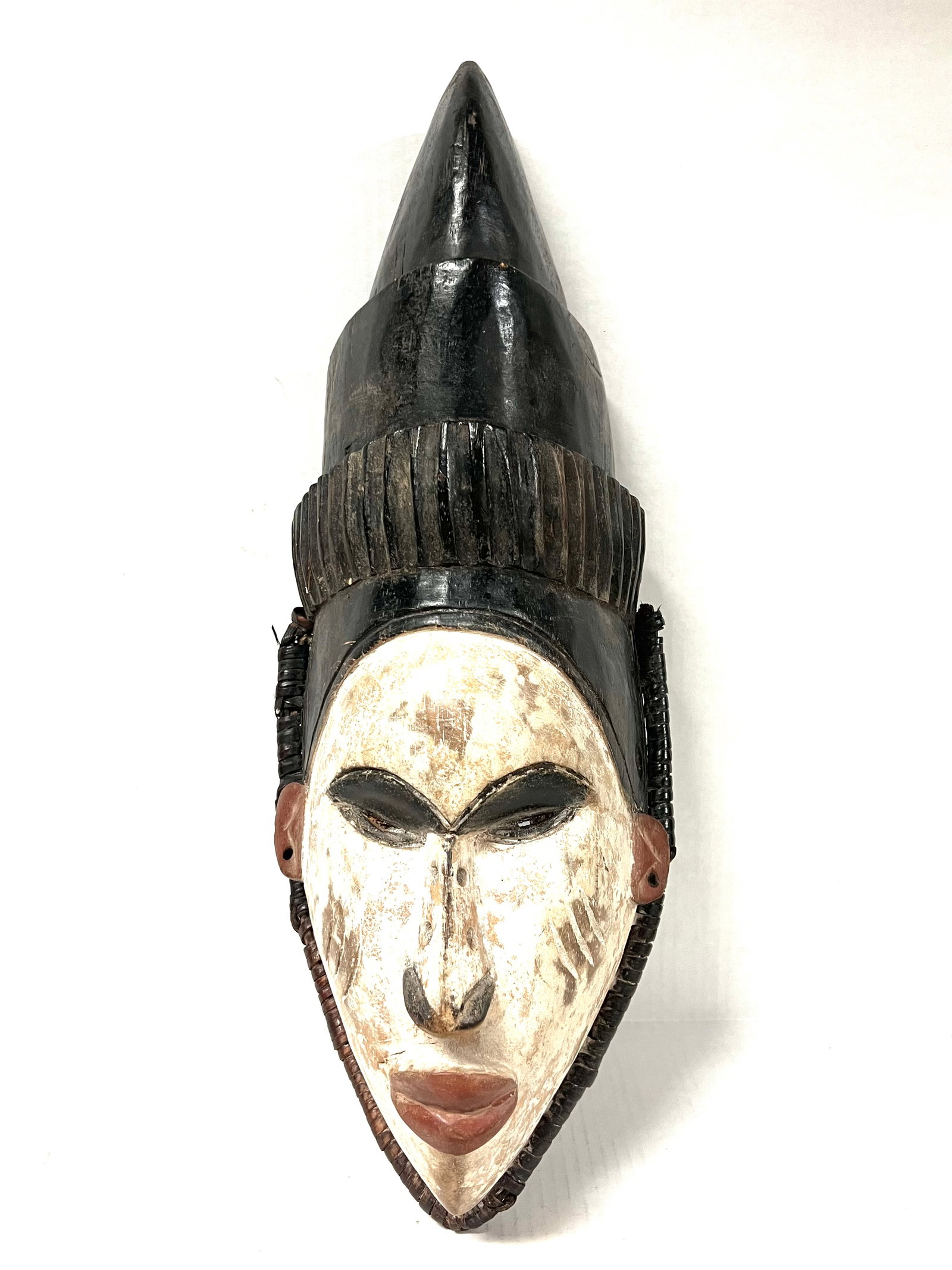 Ibo Mask: African Art Ibo Mask from Nigeria. The dimension is 21 inches high x 8 inches wide. The shipping cost for domestic is $45.00 flat rate shipping within the Continental US including handling, packing an
