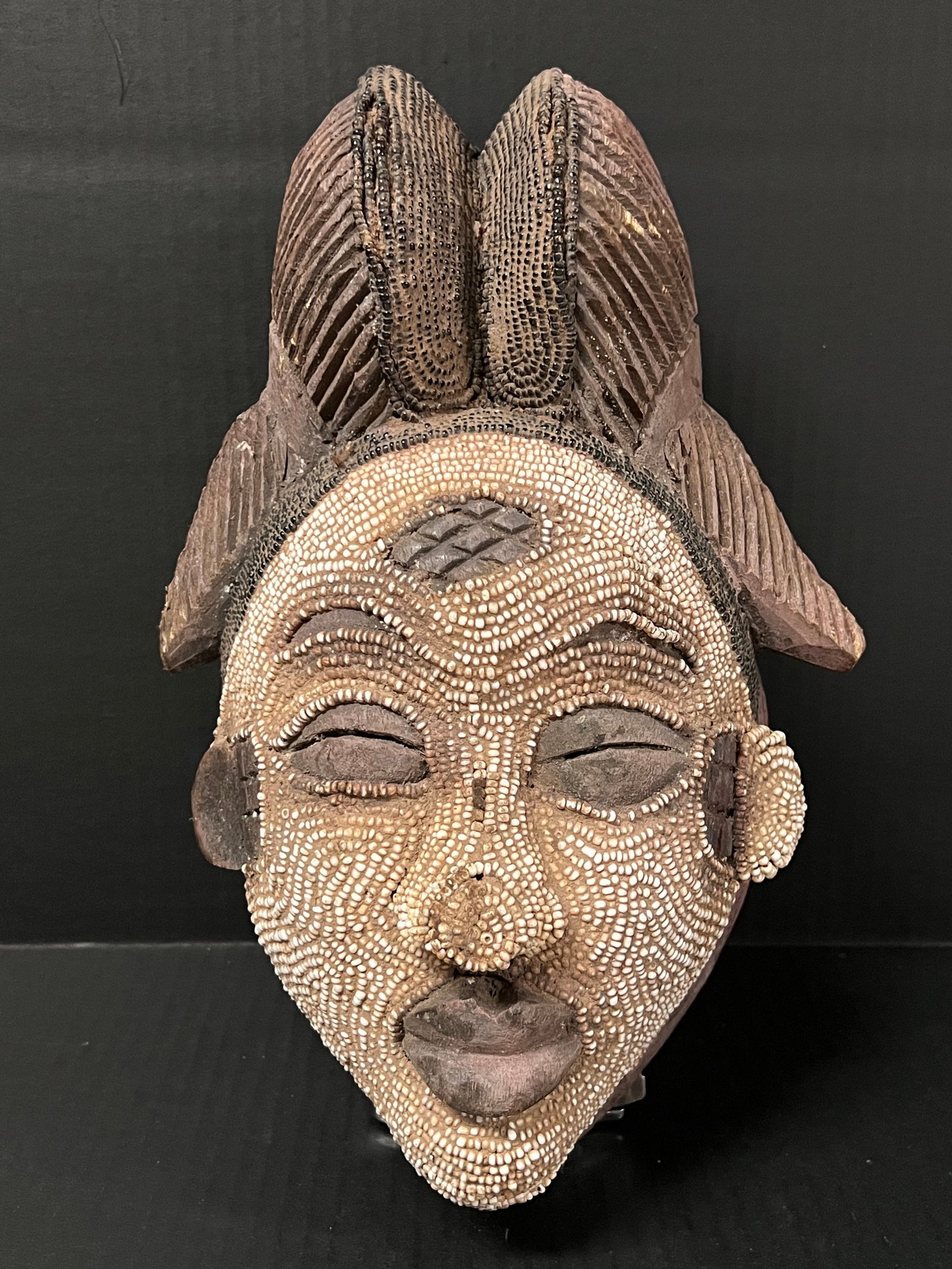 Punu Mask: African Art Carved Wood Punu Mask. The dimension 13 inches high x 9 inches wide. Please be aware that some of the items are vintage, secondhand, old ages, antiques and may have a defects or sign of ag