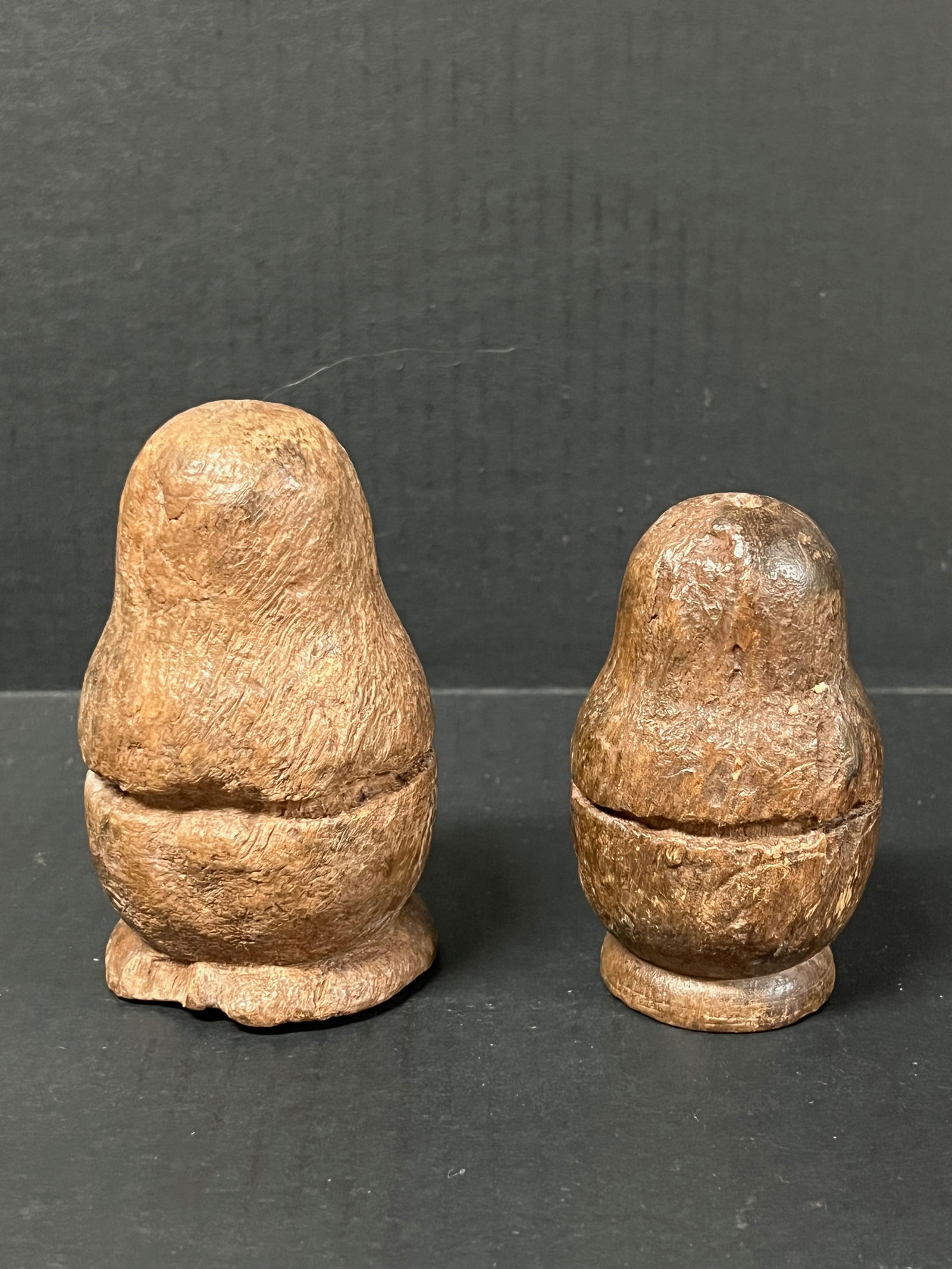 Carved Wood Nesting Doll 2 pieces: Folk Art Carved wood Papermache Mold Nesting Doll. The dimension is estimated 4.75 inches high x 3 inches wide. Please be aware that some of the items are vintage, secondhand, old ages, antiques and m