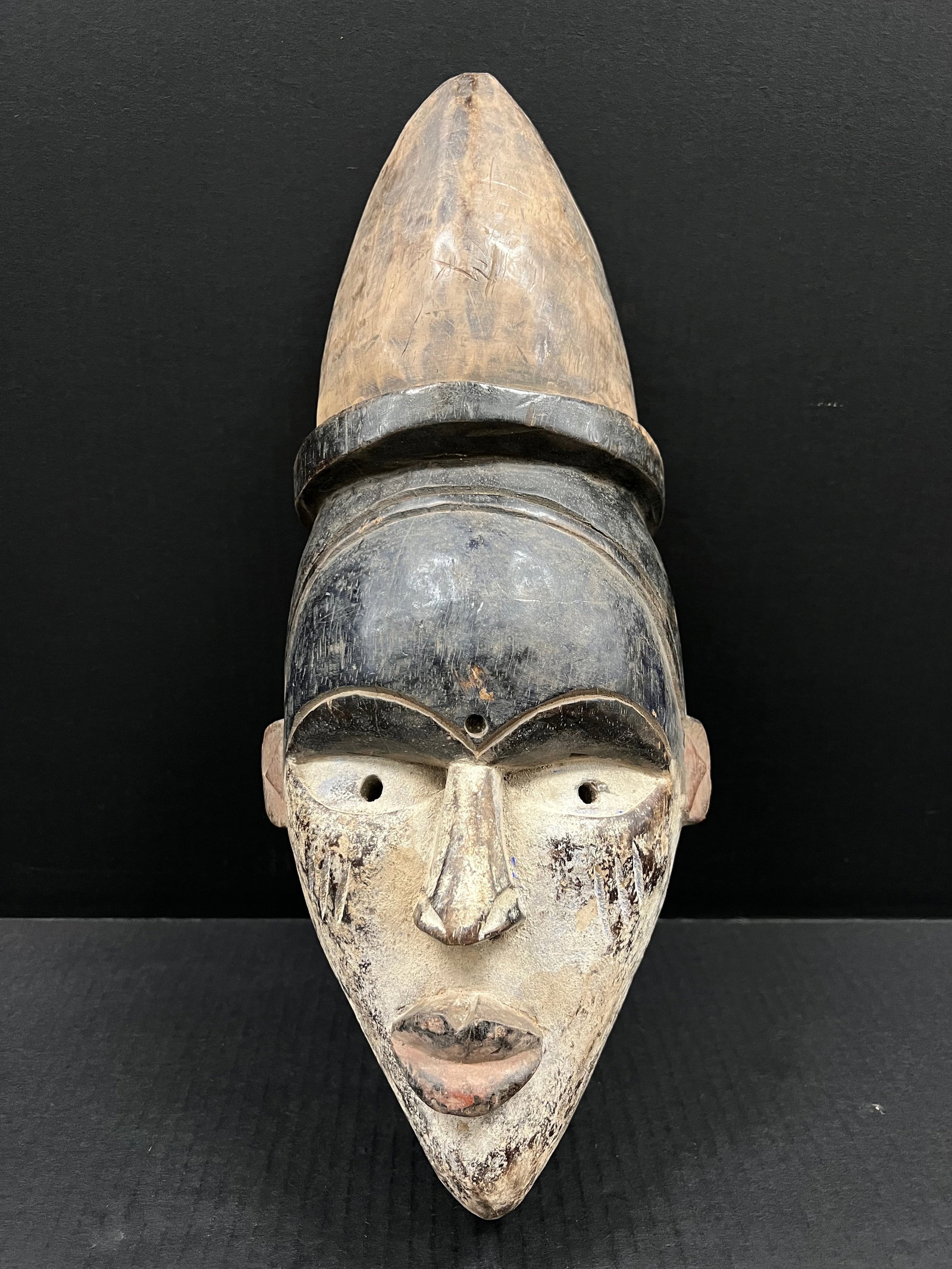 Ibo Mask: African Art Ibo Mask. The dimension is 17.25 inches high x 7.5 inches wide. Please be aware that some of the items are vintage, secondhand, old ages, antiques and may have a defects or sign of ages, H