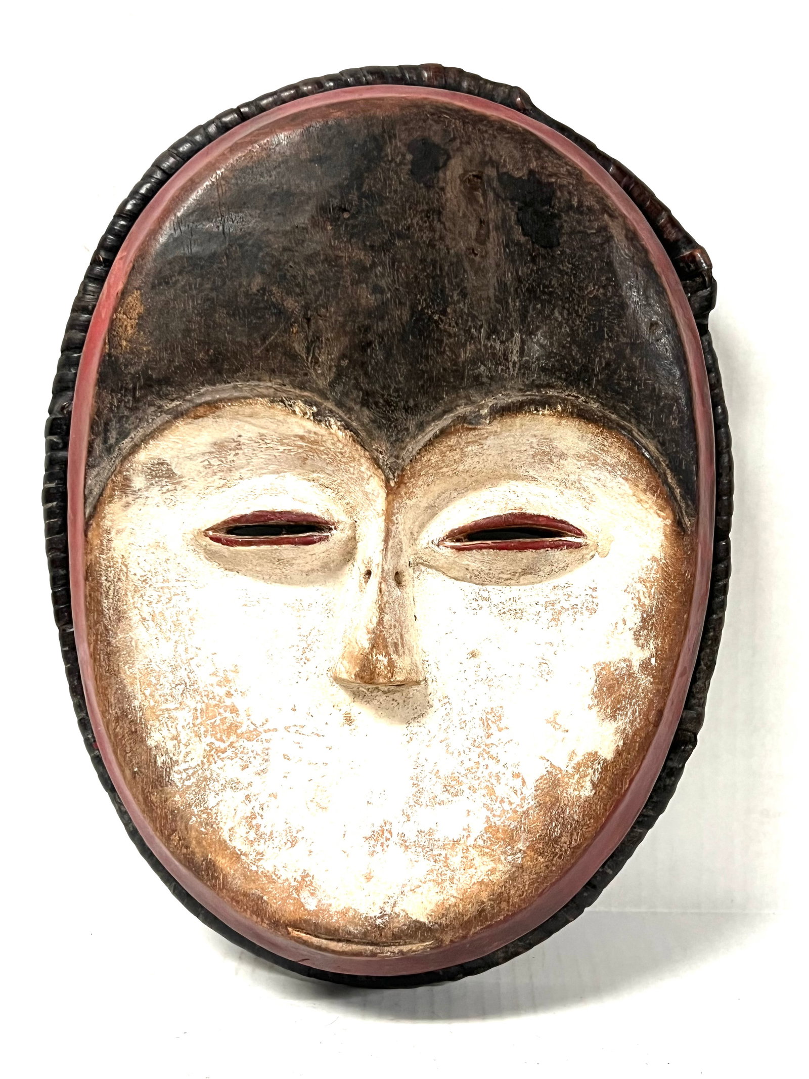 Kwele Mask: African Tribal Art Kwele Mask. The dimension is 14 inches high x 11 inches wide. Please be aware that some of the items are vintage, secondhand, old ages, antiques and may have a defects or sign of ag