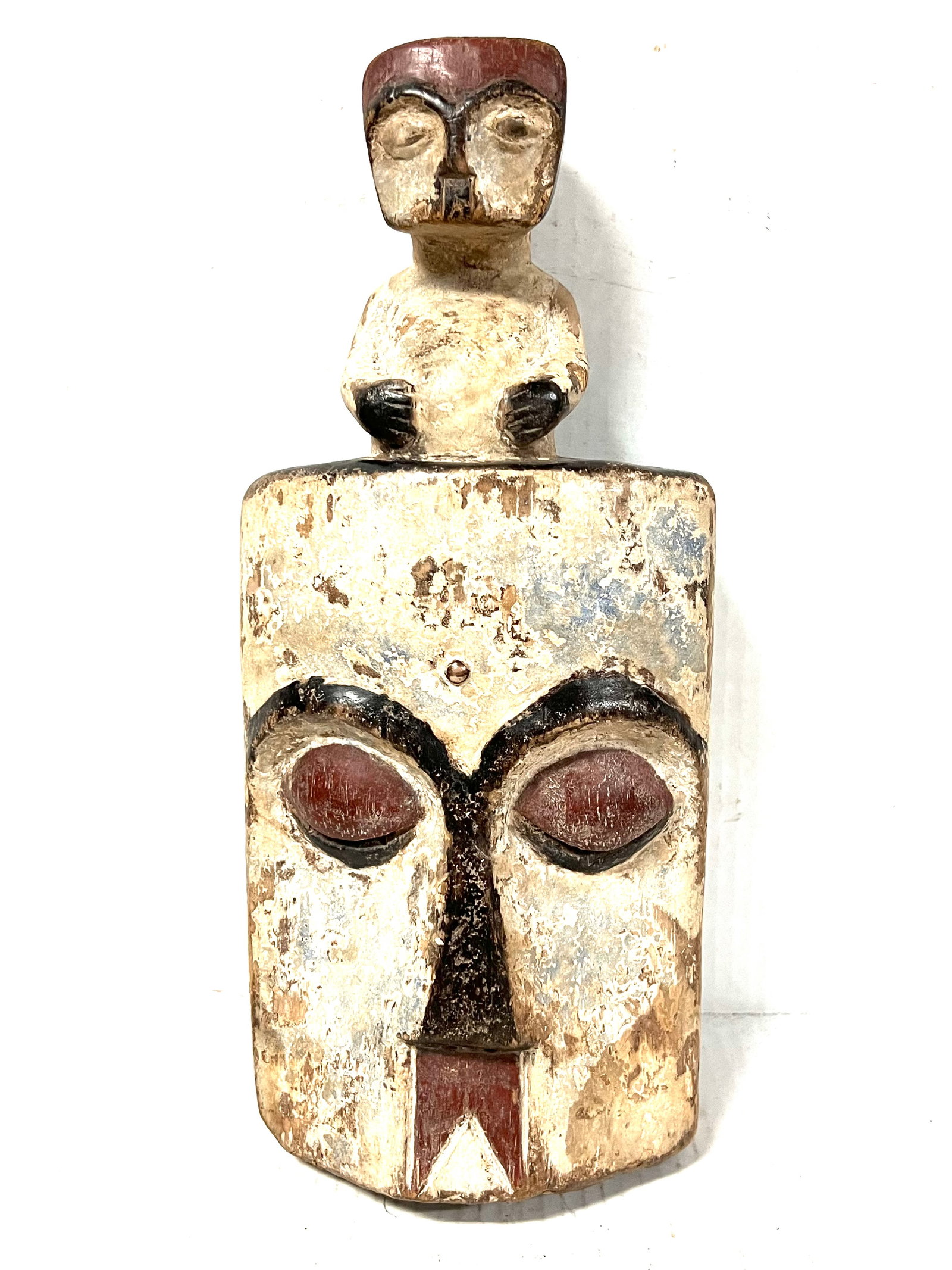 Kwele Mask: African Tribal Art Kwele Mask. The dimension is 13.5 inches high x 6 inches wide. Please be aware that some of the items are vintage, secondhand, old ages, antiques and may have a defects or sign of a