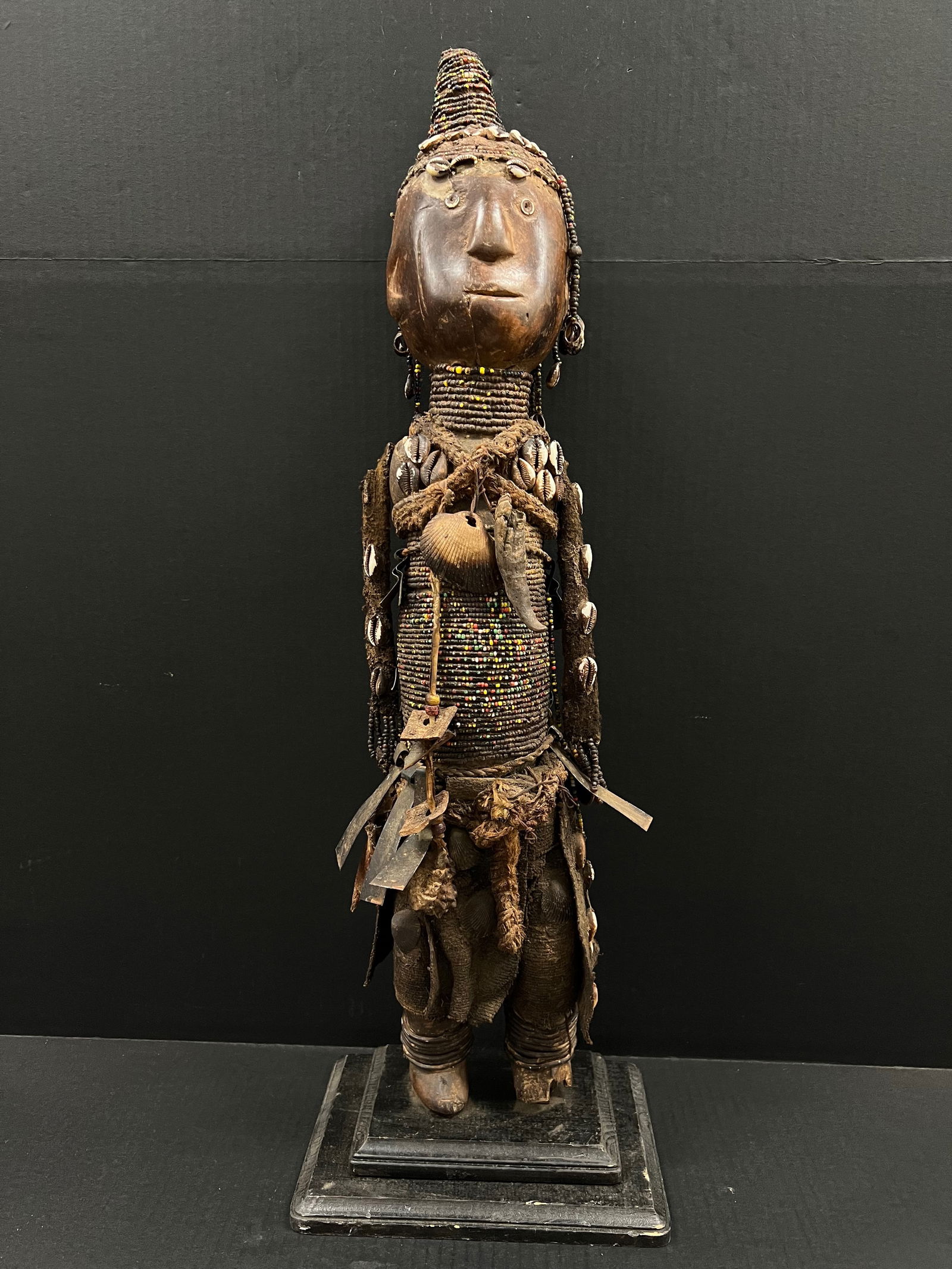 Large Makonde Beaded Doll: African Tribal Art Makonde Beaded Dolll. The dimension is 29 inches high x 6 inches wide. Please be aware that some of the items are vintage, secondhand, old ages, antiques and may have a defects or s