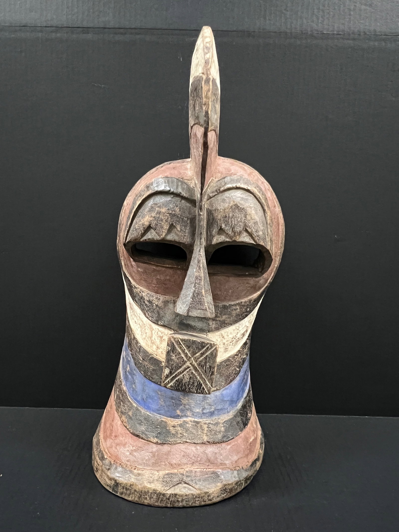 Songye Mask: African Tribal Art Songye Mask. The dimension is 22 inches high x 9 inches wide. Please be aware that some of the items are vintage, secondhand, old ages, antiques and may have a defects or sign of ag