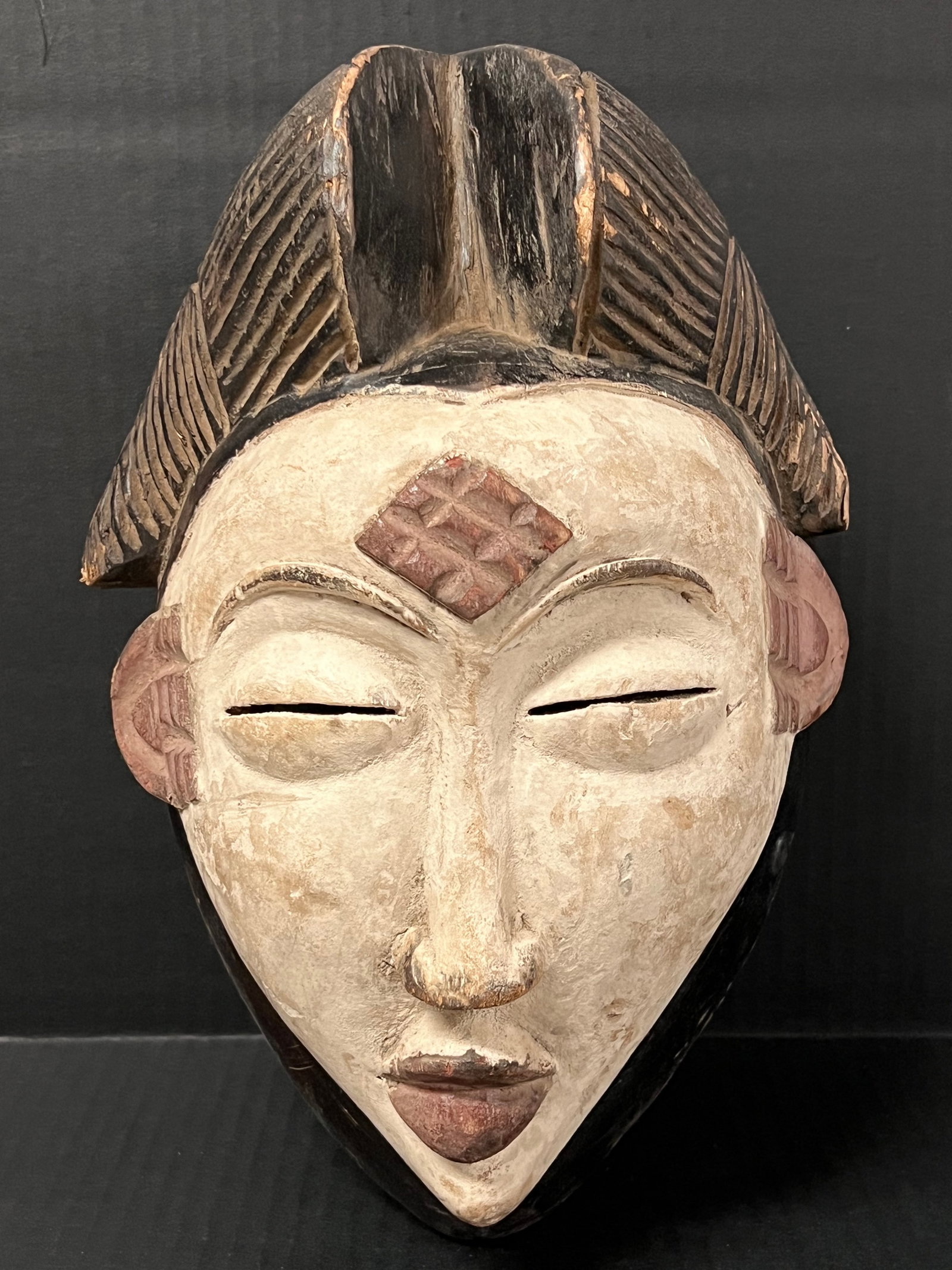 Punu Mask: African Tribal Art Punu Mask. The dimension is 12.5 inches high x 8.5 inches wide. Please be aware that some of the items are vintage, secondhand, old ages, antiques and may have a defects or sign of 
