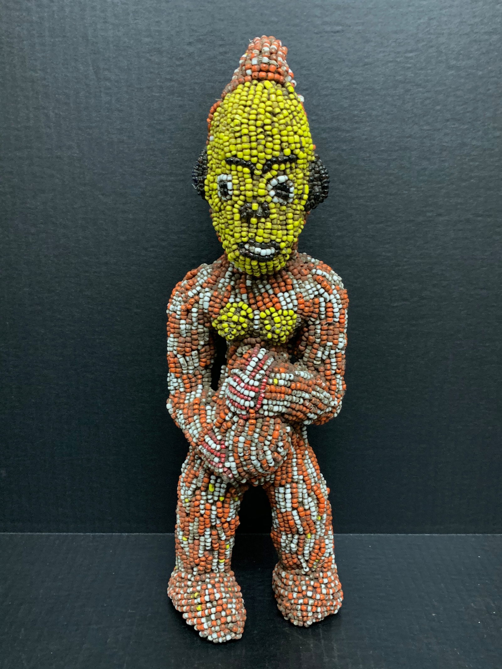 Bamileke Beaded Statue: African Tribal Art Bamileke Beaded Statue . The dimension is 16 inches high x 6.5 inches wide. Please be aware that some of the items are vintage, secondhand, old ages, antiques and may have a defects