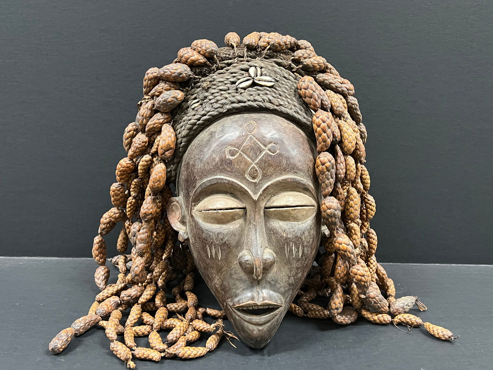 Songye Mask: African Tribal Art Songye Mask. The dimension is 14 inches high x 9 inches wide. Please be aware that some of the items are vintage, secondhand, old ages, antiques and may have a defects or sign of ag