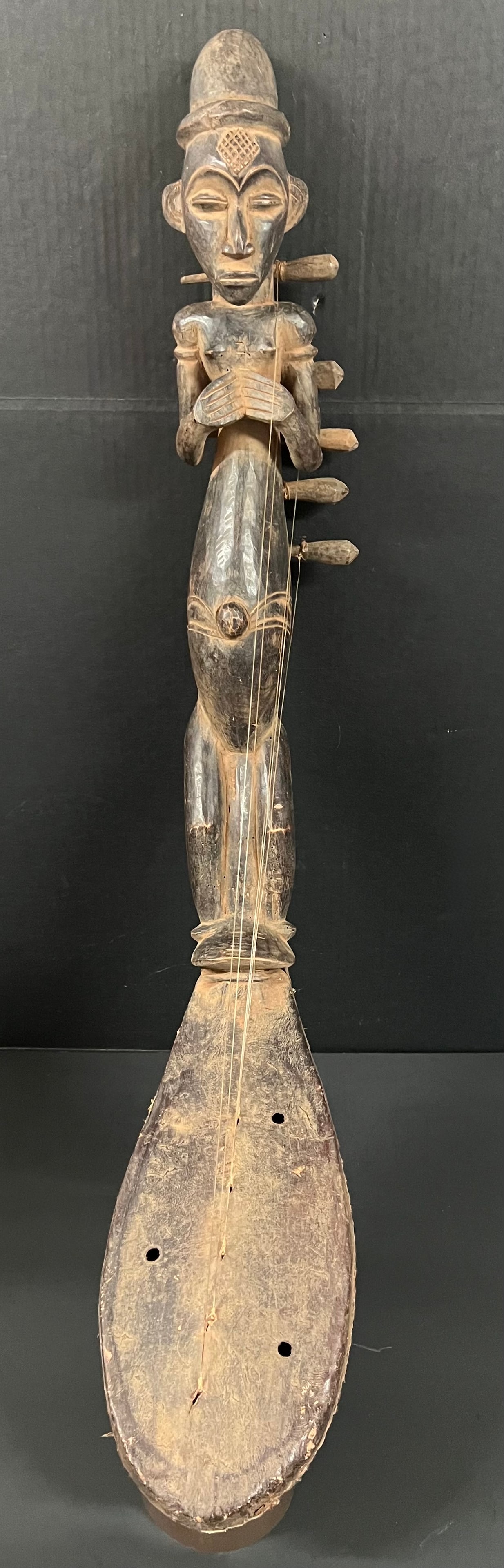 Mangbetu Harp Instrument: African Tribal Art Mangbetu Harp Instrument. The dimension is 36 inches high x 20 inches wide. Please be aware that some of the items are vintage, secondhand, old ages, antiques and may have a defects