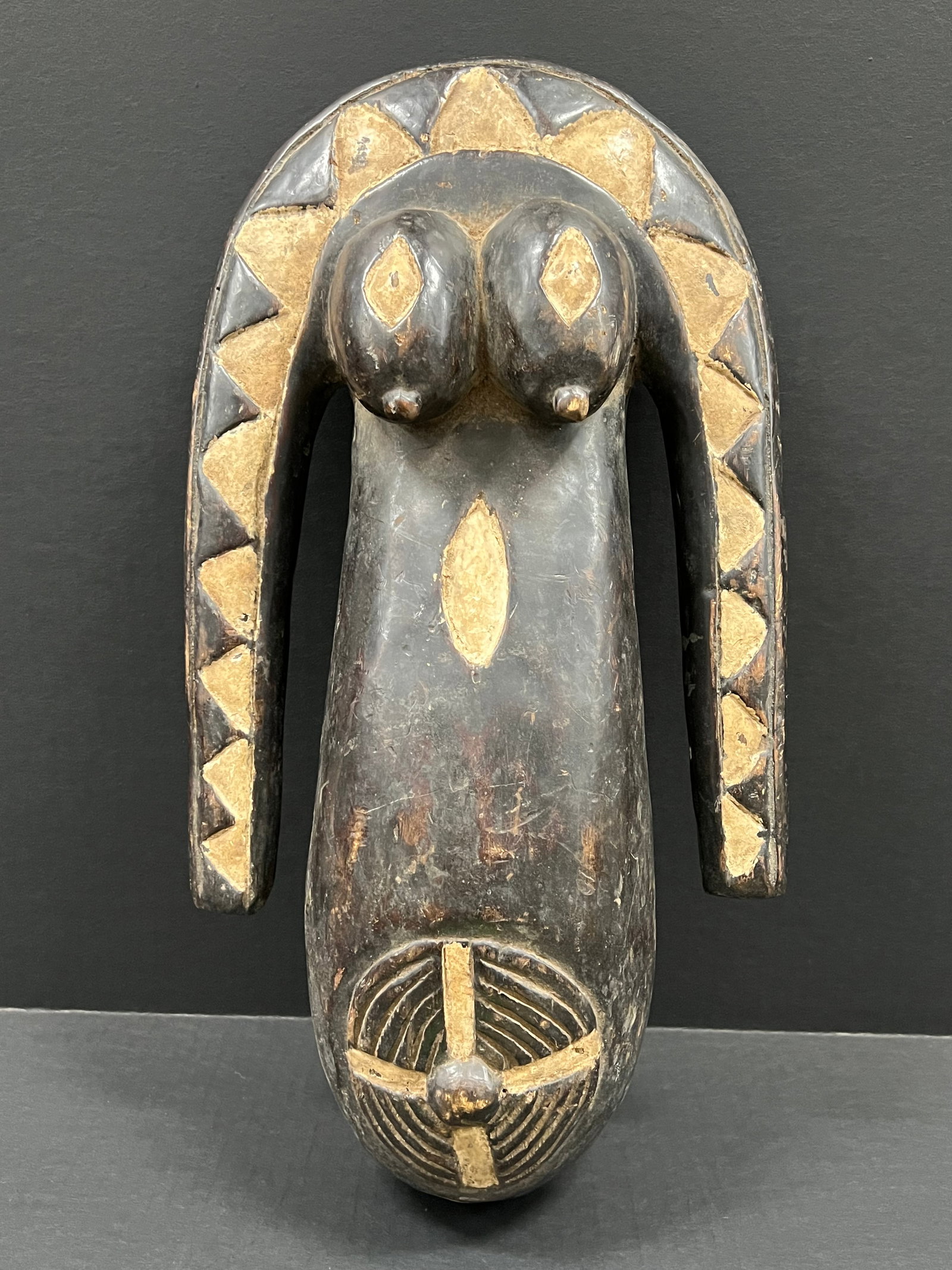 Makonde Belly Mask: African Tribal Art Makonde Belly Mask. The dimension is 20 inches high x 10.75 inches wide. Please be aware that some of the items are vintage, secondhand, old ages, antiques and may have a defects or