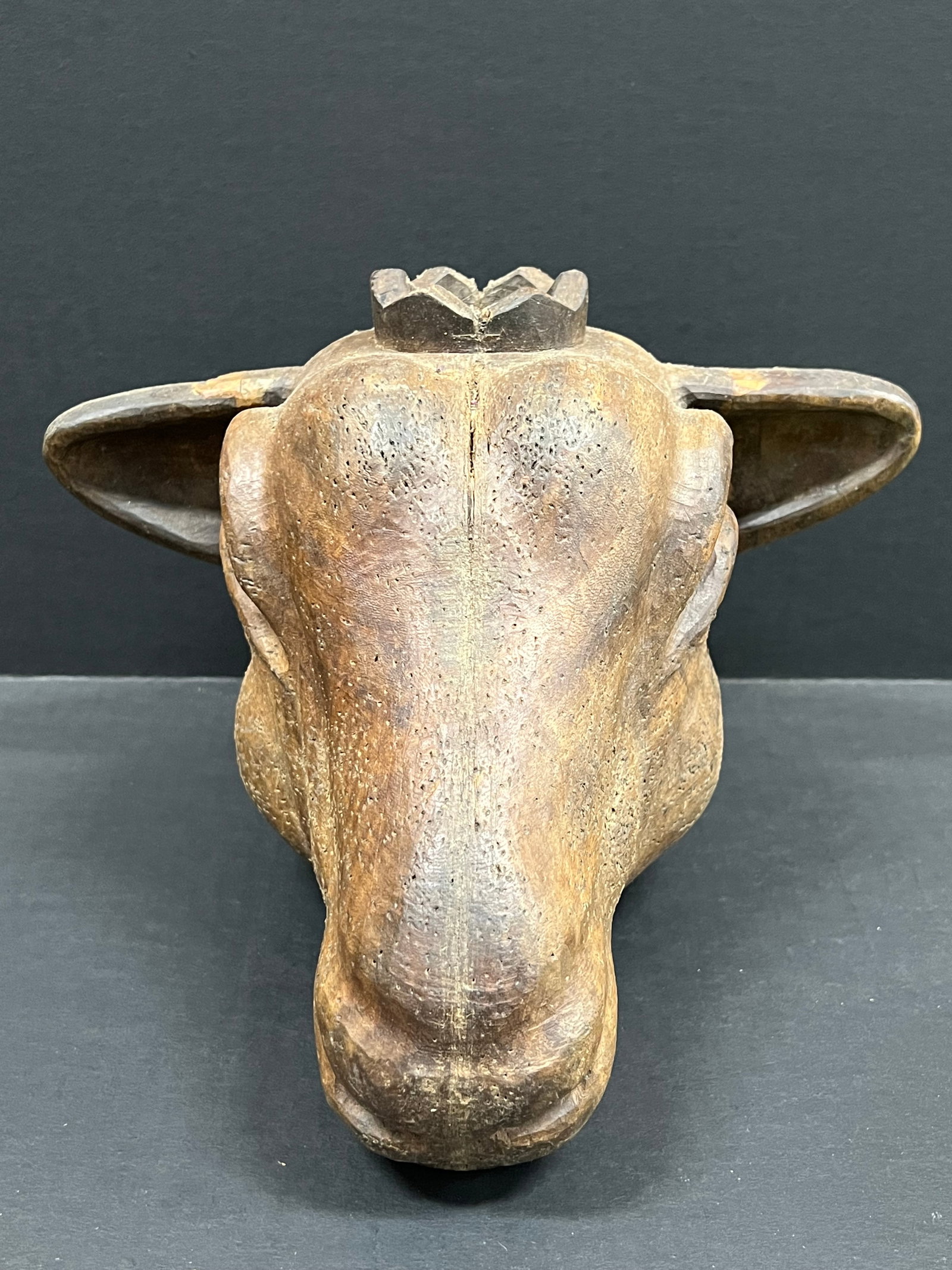 Carved Wood Goat Head: Folk Art Carved Wood Goat Head. The dimension is 7.5 inches high x 11 inches depth x 10 inches wide. Please be aware that some of the items are vintage, secondhand, old ages, antiques and may have a d
