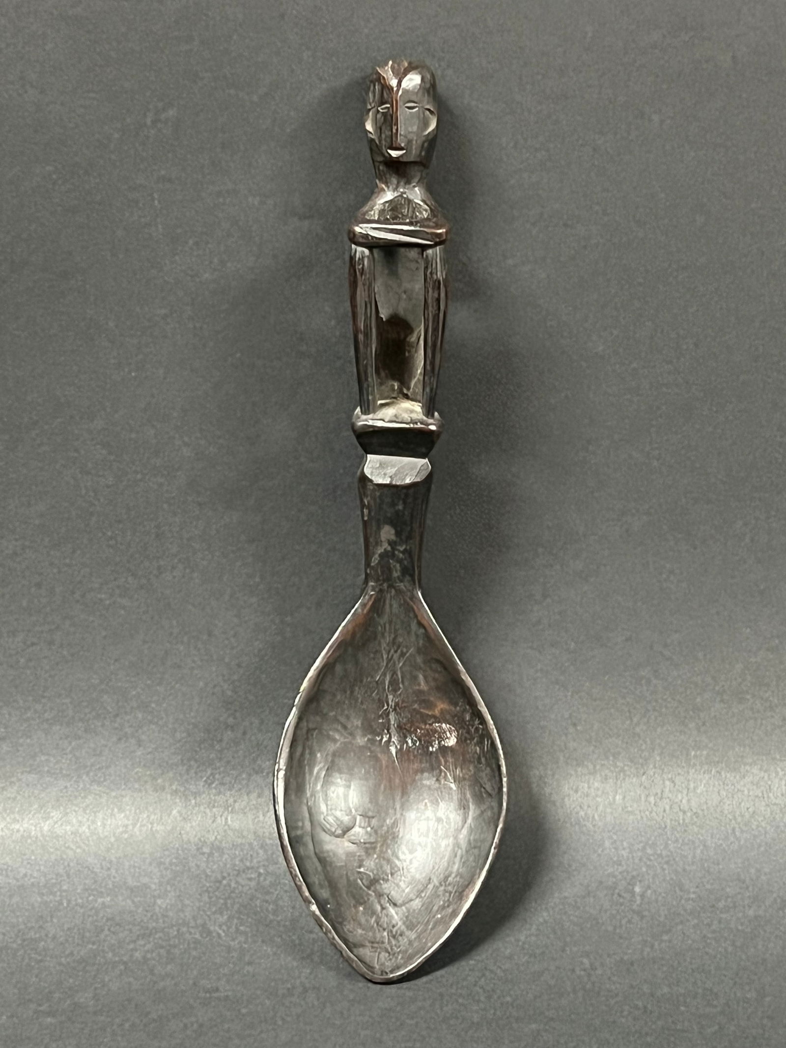 Philippine Ifugao Wooden Figural Spoon: Tribal Art Philippine Ifugao Wooden Figural Spoon. The dimension is 8.25 inches high x 2.5 inches wide. Please be aware that some of the items are vintage, secondhand, old ages, antiques and may have