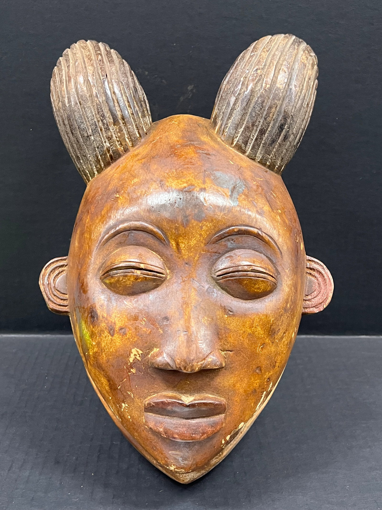 Lumbo Mask: African Tribal Art Lumbo Mask. The dimension is 14 inches high x 8.5 inches wide. Please be aware that some of the items are vintage, secondhand, old ages, antiques and may have a defects or sign of a