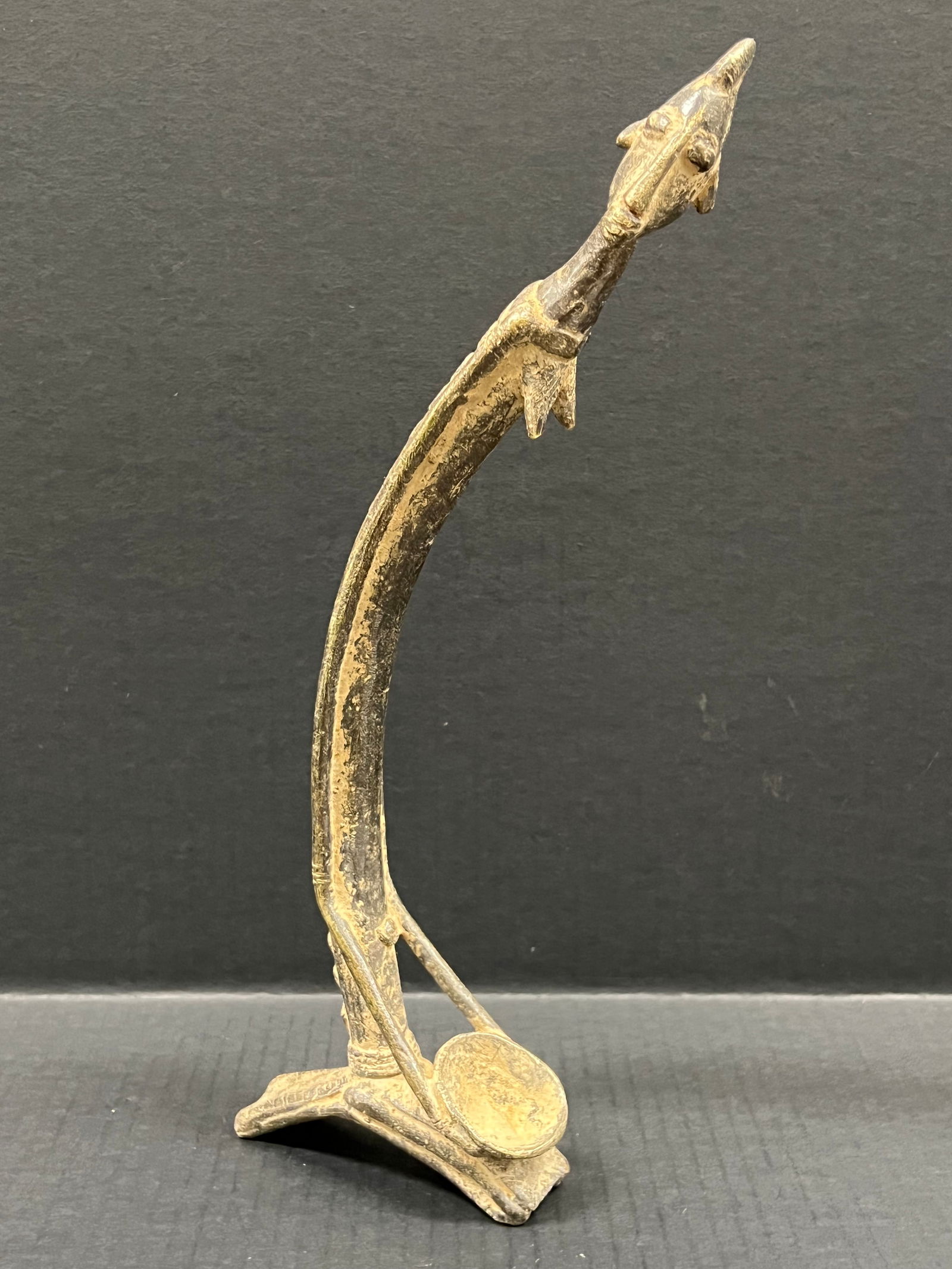 Bronze Dogon Statue: African Tribal Art Bronze Dogon Statue. The dimension is 14 inches high x 4.5 inches wide. Please be aware that some of the items are vintage, secondhand, old ages, antiques and may have a defects or