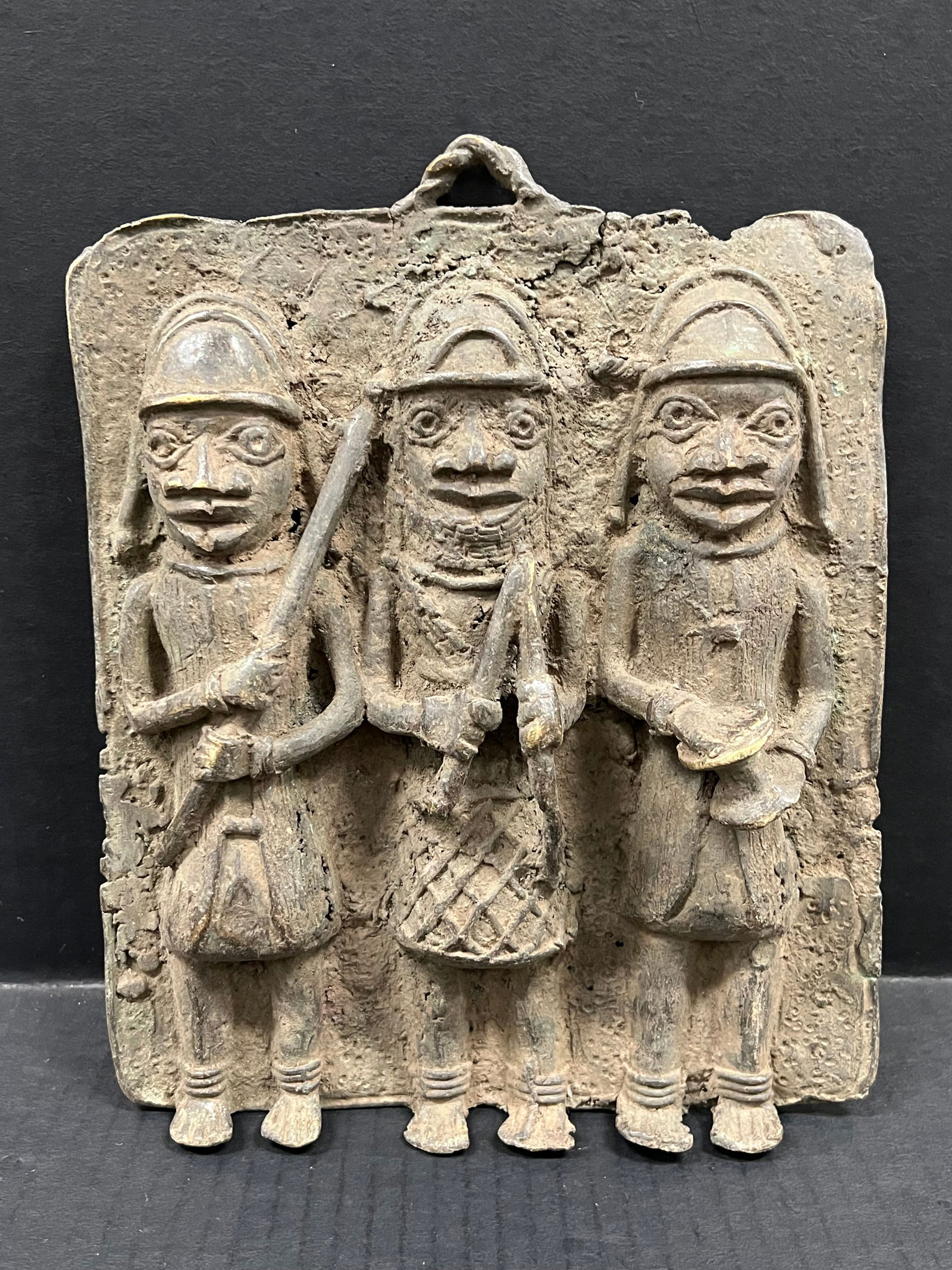 Benin Bronze Plaque: African Tribal Art Benin Bronze Plaque. The dimension is 10.5 inches high x 8.5 inches wide. Please be aware that some of the items are vintage, secondhand, old ages, antiques and may have a defects o