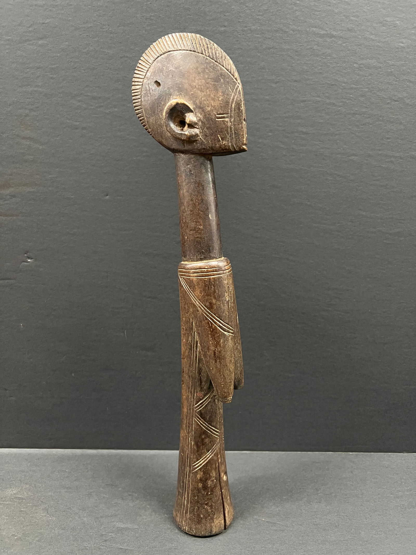 Mossi Fertility Doll: African Tribal Art Mossi Fertility Doll. The dimension is 14.5 inches high x 3.25 inches wide. Please be aware that some of the items are vintage, secondhand, old ages, antiques and may have a defects